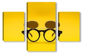Модульная картина Солнцезащитные очки с двойным стеклом на желтом фоне